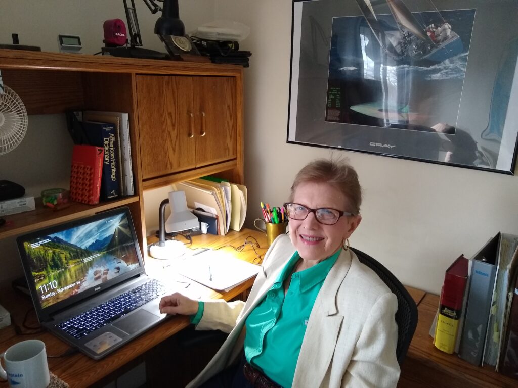 Debra Axness at her desk
